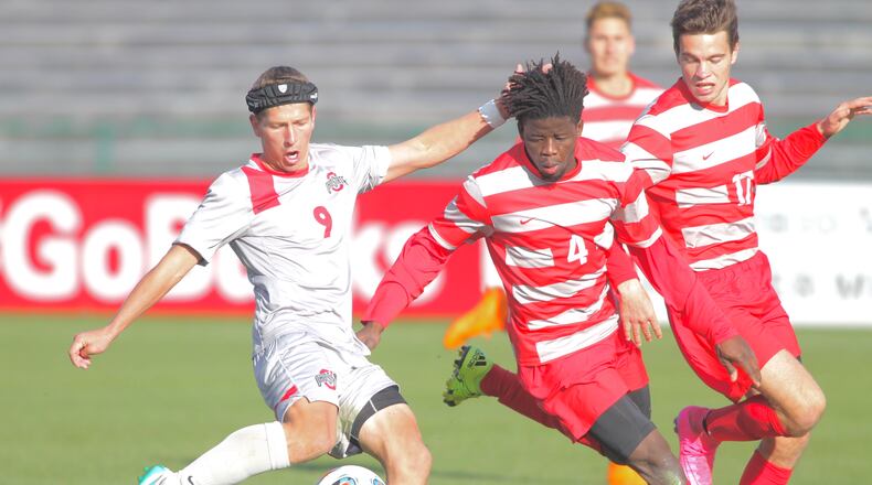 Ohio State's Danny Jenson, left, scores the game-tying goal in the second half as Dayton's Lalas Abubakar defends in the second round of the NCAA tournament on Sunday, Nov. 22, 2015, at Jesse Owens Memorial Stadium in Columbus. David Jablonski/Staff