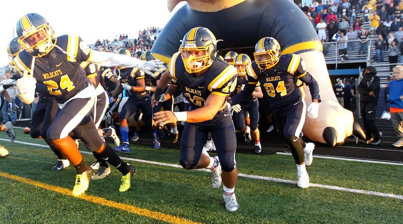 Springfield players take the field for a game against Xenia on Friday, Sept. 28, 2018, at Evans Stadium in Springfield. David Jablonski/Staff