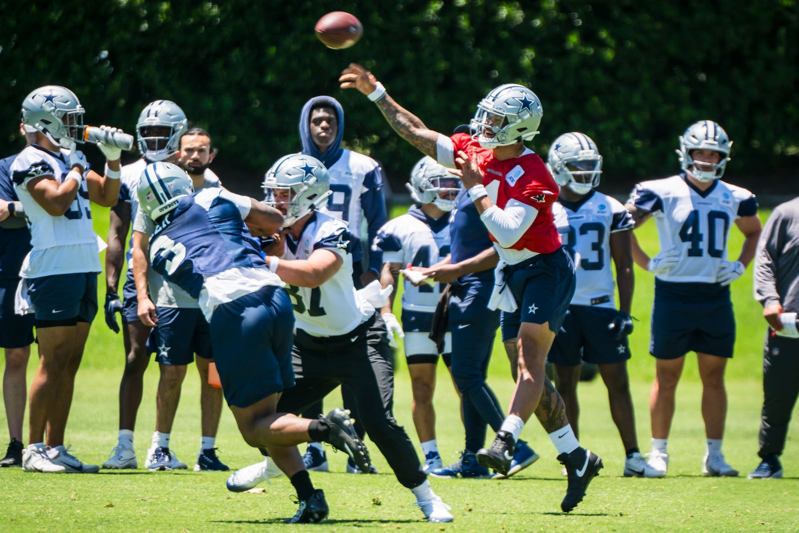 Dallas Cowboys' Dak Prescott throws the football during NFL football practice at the Cowboys facility, Tuesday, May 20, 2025, in Frisco, Texas. (AP Photo/Jessica Tobias)