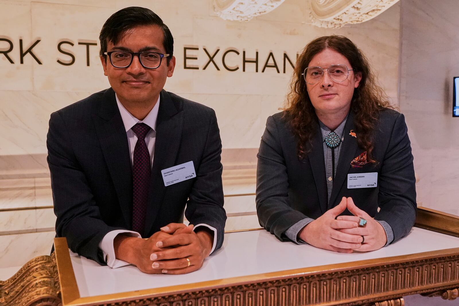 XPRIZE Carbon Removal winners from Mati Carbon, Founder & CEO Shantanu Agarwal, left, and Chief Science Officer Jake Jordan, visit the trading floor of the New York Stock Exchange, Tuesday, April 22, 2025. (AP Photo/Richard Drew)