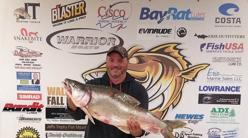 James Beres and the largest lake trout ever caught in Ohio. CONTRIBUTED