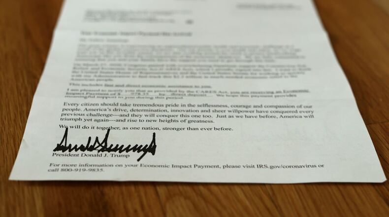 WASHINGTON, DC - APRIL 29: A letter bearing the signature of U.S. President Donald Trump was sent to people who received a coronavirus economic stimulus payment as part of the Cares Act April 29, 2020 in Washington, DC. The letter had a return address for the Internal Revenue Service in Austin, Texas, but was printed on White House letterhead. The initial 88 million payments totaling nearly $158 billion were sent by the Treasury Department last week as most of the country remains under stay-at-home orders due to the COVID-19 pandemic.