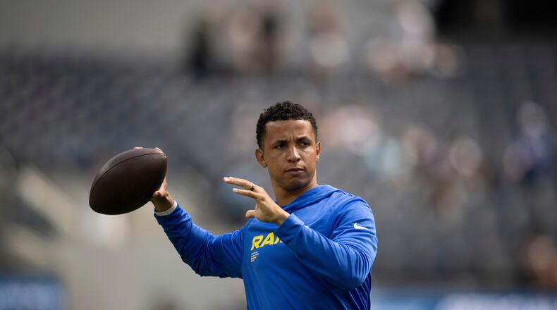 FILE - Los Angeles Rams pass game coordinator Nate Scheelhaase throws the ball before an NFL preseason football game against the Dallas Cowboys, Saturday, Aug. 9, 2025, in Inglewood, Calif. (AP Photo/Kyusung Gong, File)