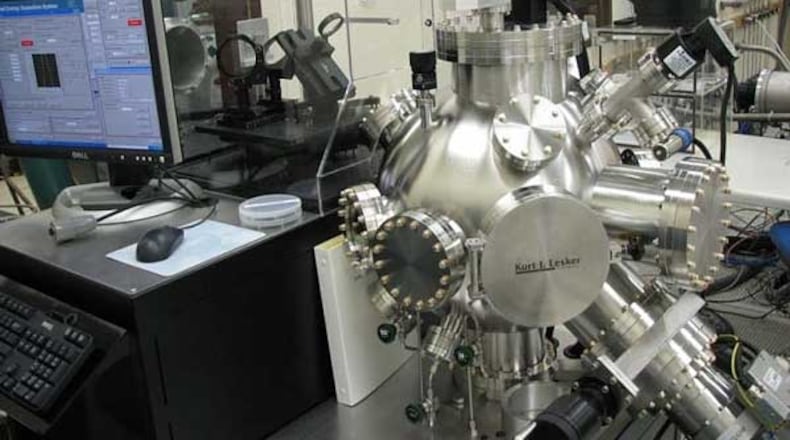 Equipment the University of Dayton uses for fabrication of variable capacitor devices. It is called a Pulsed Laser Deposition System. UD uses a pulsed laser to deposit ceramic thin film material in a system meant to help the military resist electronic warfare jamming. Contributed.