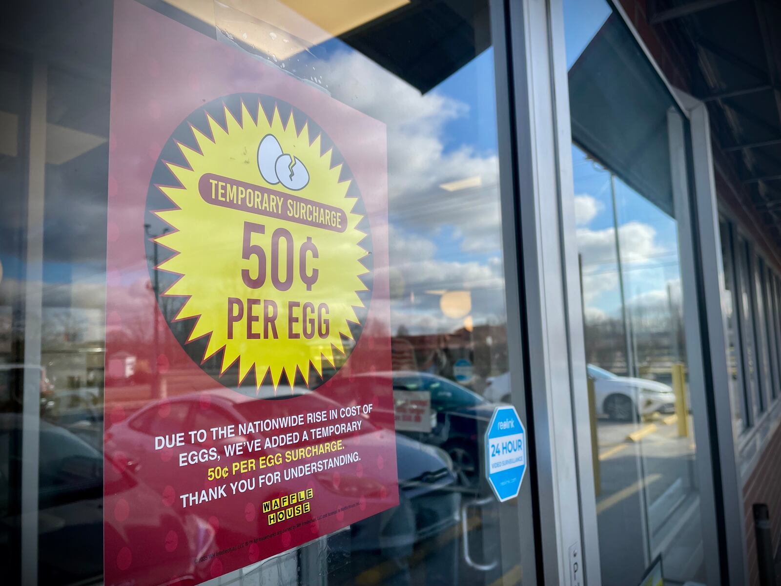 The Waffle House located at 1107 E. Dayton Yellow Springs Road in Fairborn has a sign posted on the front door saying that they've added a temporary 50 cent per egg surcharge due to the nationwide rise in cost of eggs. NATALIE JONES/STAFF