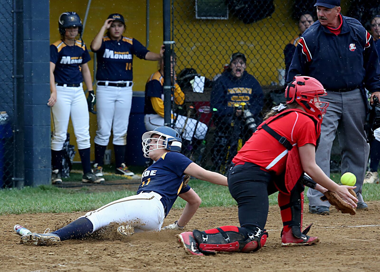 Monroe’s Faith Hensley slides safely across the plate as Franklin catcher Tara Johnson takes the throw during Wednesday’s game at Monroe. CONTRIBUTED PHOTO BY E.L. HUBBARD
