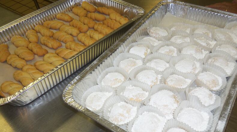 Pans of Koulouria (a Greek butter cookie) and Kourambiedes (a soft butter cookie with powder sugar) from a previous Dayton Greek Festival. FILE