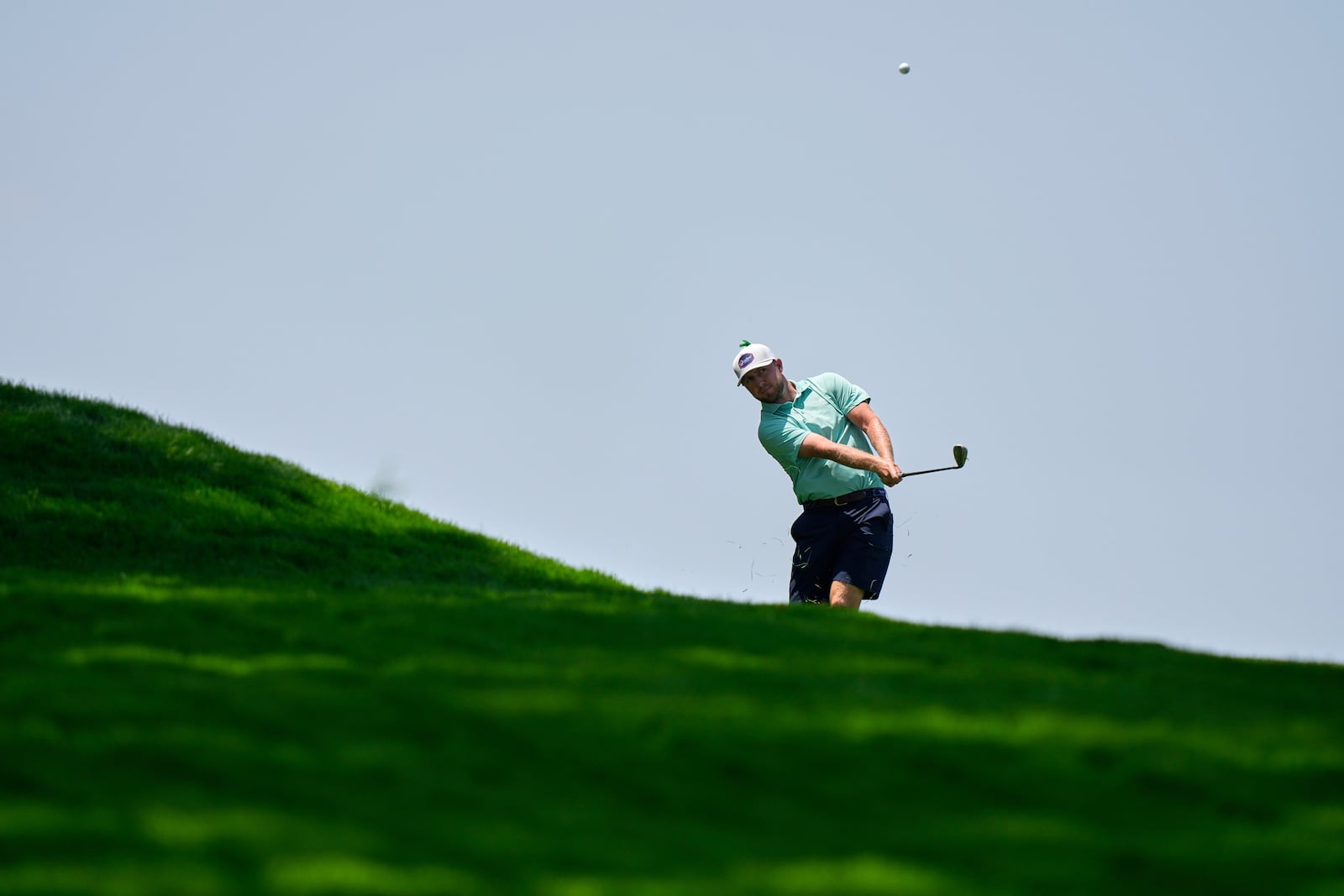 Alistair Docherty hits from the first fairway during a practice round ahead of the U.S. Open golf tournament at Oakmont Country Club Wednesday, June 11, 2025, in Oakmont, Pa. (AP Photo/Charlie Riedel)