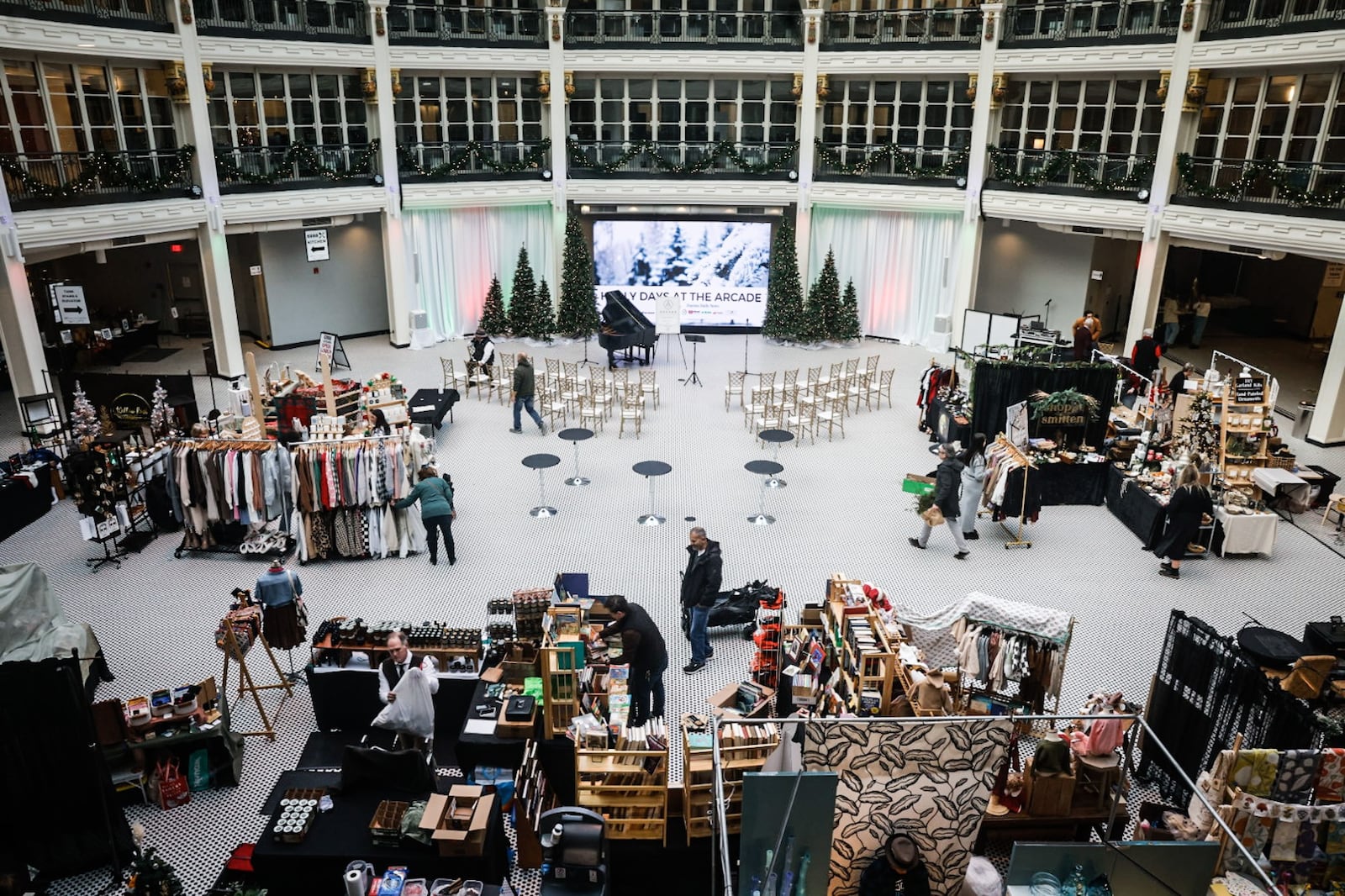 Dozens of vendors and hundreds of holiday shoppers gather for Holly Days at the Arcade. STAFF
