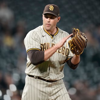 San Diego Padres relief pitcher Craig Stammen reacts after getting Colorado Rockies' Brian Serven to ground out to end the ninth inning of a baseball game Saturday, Sept. 24, 2022, in Denver. (AP Photo/David Zalubowski)