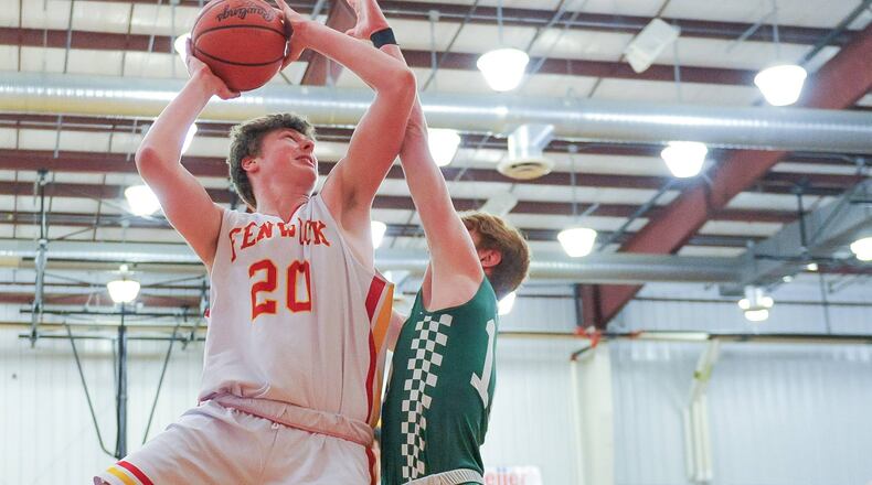 Fenwick's AJ Braun drives to the basket defended by Badin's Zach Switzer during their basketball game Friday, Jan. 18 at Bishop Fenwick High School in Middletown. Fenwick won 56-45. NICK GRAHAM/STAFF