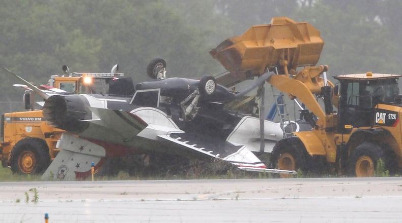 A Thunderbird jet flipped over after taxiing at Dayton International Airport on Friday, June 23, 2017. TY GREENLEES / STAFF