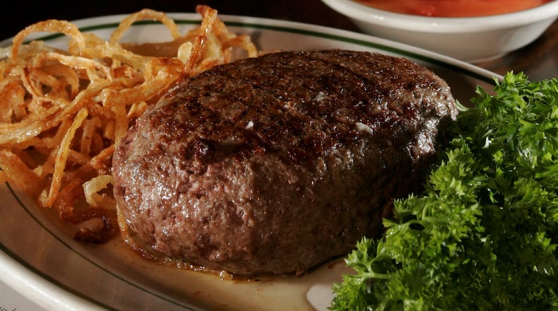 The Pine Club meal, including its signature onion rings. 2008 staff file photo by Lisa Powell