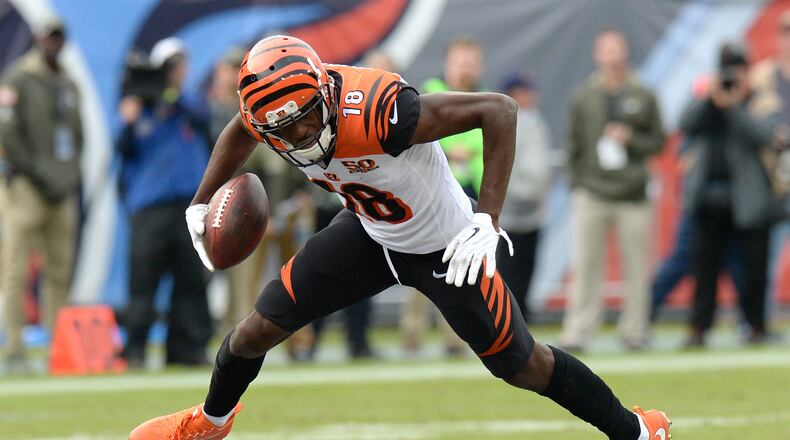 Cincinnati Bengals wide receiver A.J. Green breaks away from defenders as he scores a touchdown on a 70-yard pass play against the Tennessee Titans in the second half of an NFL football game Sunday, Nov. 12, 2017, in Nashville, Tenn. (AP Photo/Mark Zaleski)