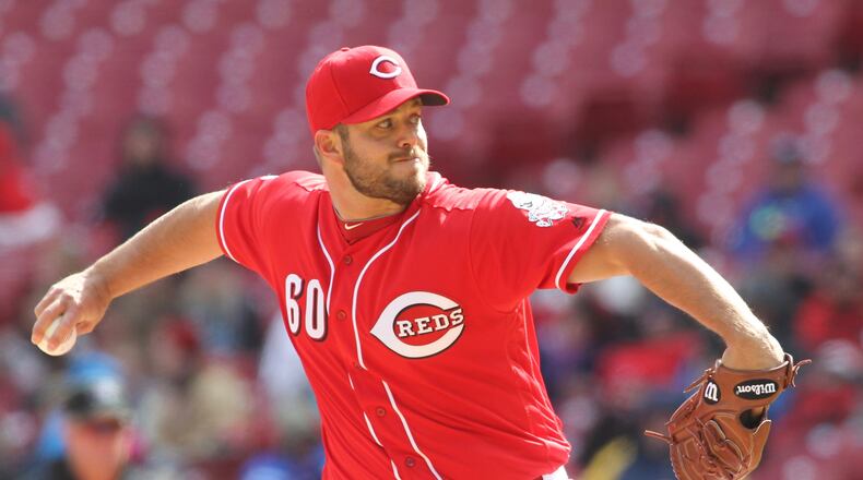 Reds closer J.J. Hoover pitches in the ninth inning against the Pirates on Saturday, April 9, 2016, at Great American Ball Park in Cincinnati. David Jablonski/Staff