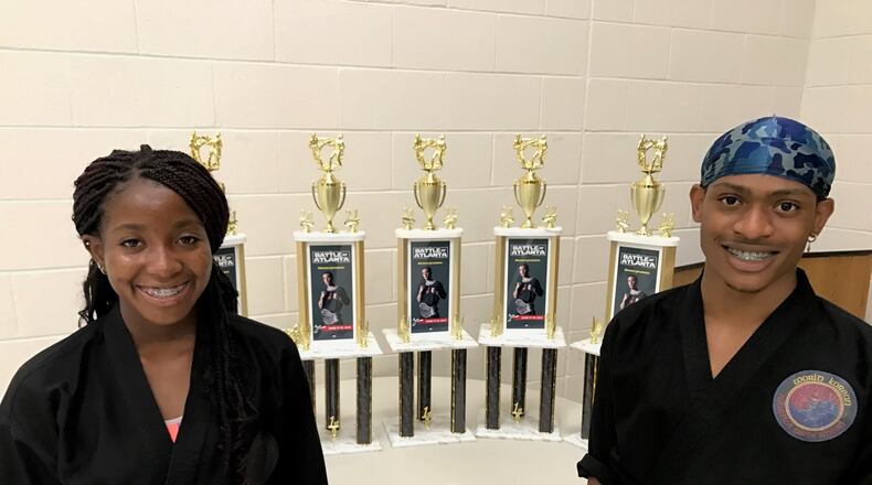 Sidnei Byrd and Vincent Jackson with the trophies they won at the prestigious Battle of Atlanta completion in Georgia last month. Jackson was first in weapons, sparring and forms. while Byrd was tops in weapons and sparring and third in forms. Tom Archdeacon/STAFF