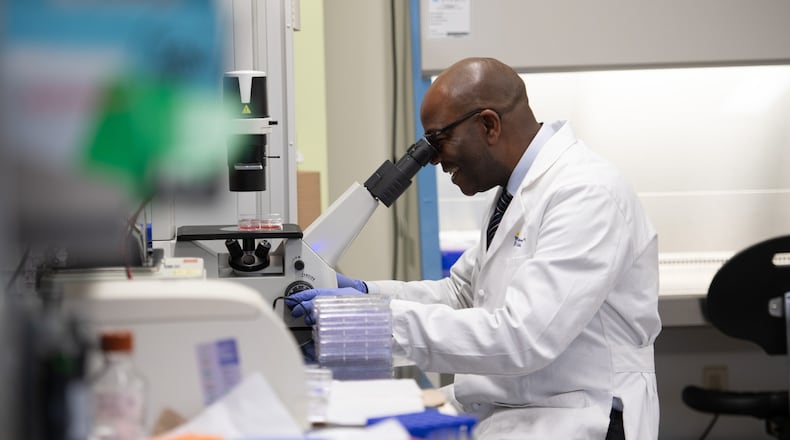 Dr. Samson Amos studies human cells in his laboratory at Cedarville University. SCOTT HUCK/CEDARVILLE UNIVERSITY