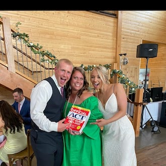 Jennifer Henson (center) with Adam Brinkman (left) and Mary Brinkman after Jennifer gave the toast at their wedding. Adam and Mary were tutoring students who met while going to back to back sessions. When they got engaged, they called Henson and asked her to give a toast at their reception. CONTRIBUTED