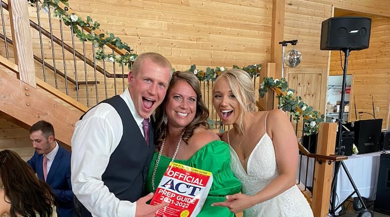 Jennifer Henson (center) with Adam Brinkman (left) and Mary Brinkman after Jennifer gave the toast at their wedding. Adam and Mary were tutoring students who met while going to back to back sessions. When they got engaged, they called Henson and asked her to give a toast at their reception. CONTRIBUTED