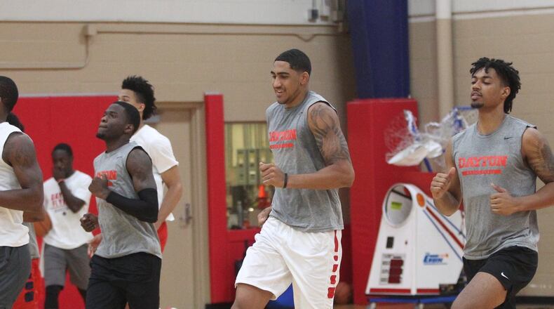 Dayton players, including Obi Toppin, center, warm up before practice at the Cronin Center on Tuesday, July 31, 2018, in Dayton. David Jablonski/Staff