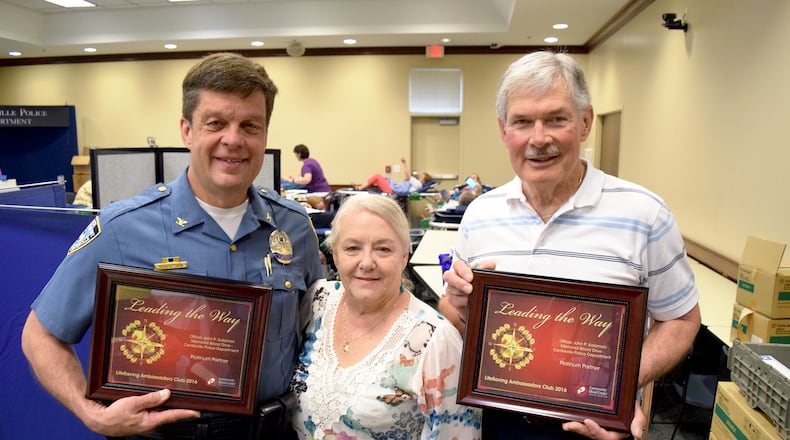 Paula and John Kalaman with retired Centerville Police Chief Bruce Robertson at 2017 Officer John P. Kalaman Memorial Blood Drive. CONTRIBUTED
