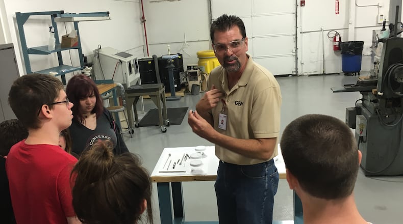 Gem City CEO Rick Wiegand talks with Carlisle High School students in a Manufacturing Day tour of the company’s plant in October 2016. A contract manufacturer, Gem City makes everything from fragrance analyzers to bomb robots. JEREMY P. KELLEY / STAFF