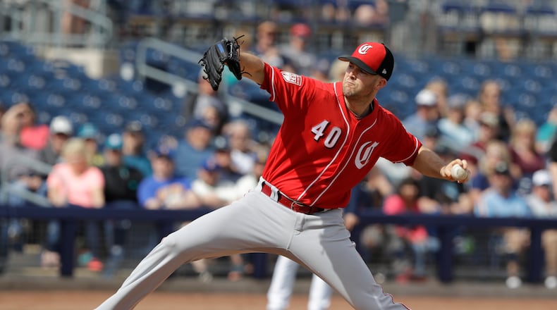 Cincinnati Reds’ Alex Wood throws during the first inning of a spring training baseball game against the Seattle Mariners, Monday, Feb. 25, 2019, in Peoria, Ariz. (AP Photo/Darron Cummings)