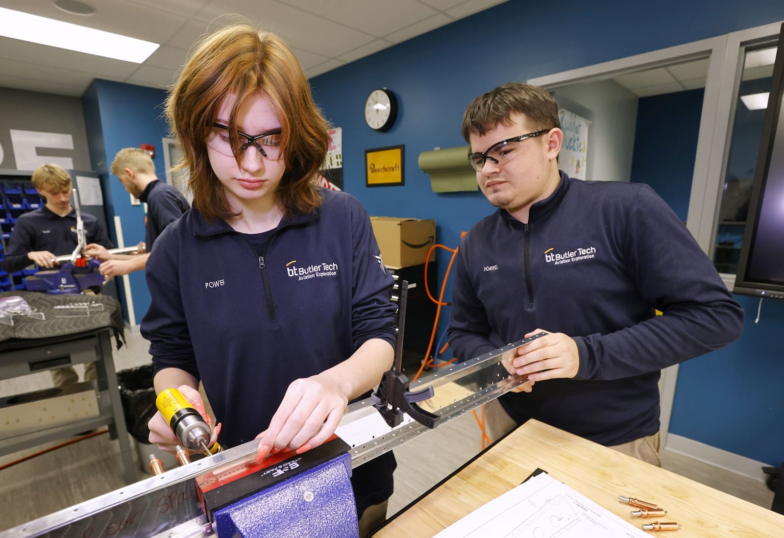 Seniors Karsen Power, left, and Jackson Sorrell work on constructing a section of an airplane during their aviation class at Butler Tech Wednesday, March 26, 2025 in Farifield Township. Students are building an airplane with parts and build plans supplied by Tango Flight. NICK GRAHAM/STAFF