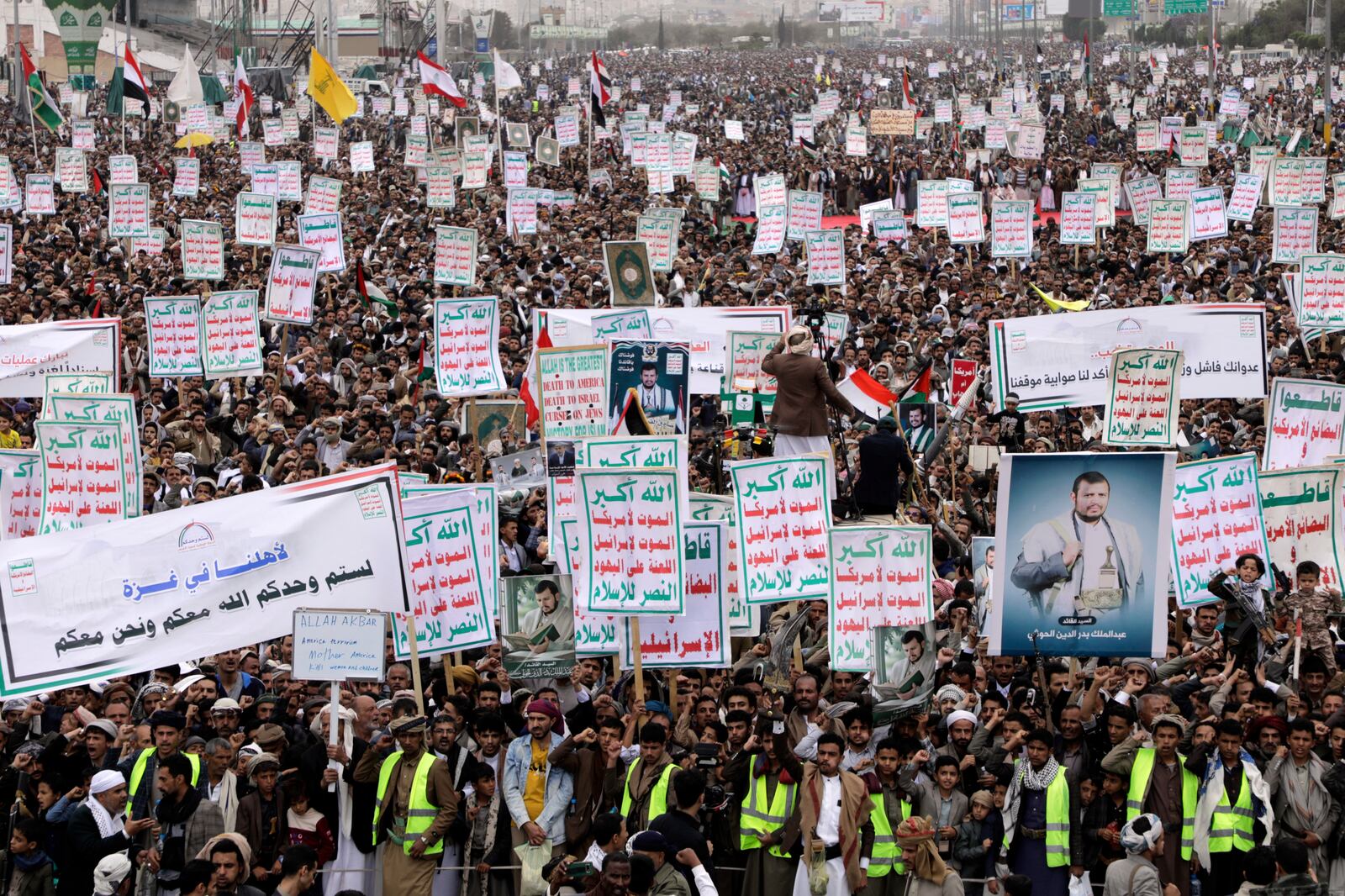 Thousands of Houthi supporters chant slogans during an anti-U.S. and anti-Israel rally in Sanaa, Yemen, Friday, April 18, 2025. (AP Photo/Osamah Abdulrahman)