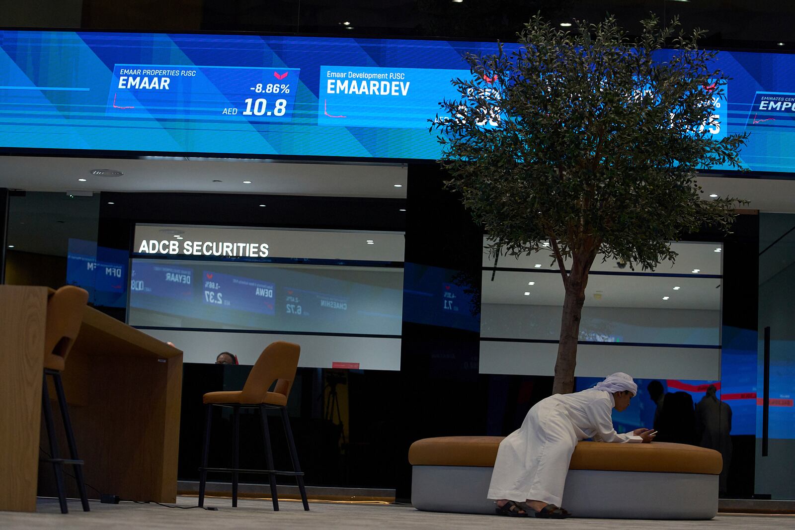 An Emirati man is seen in the Dubai Financial Market in Dubai, United Arab Emirates, Monday, April 7, 2025. (AP Photos/Fatima Shbair)