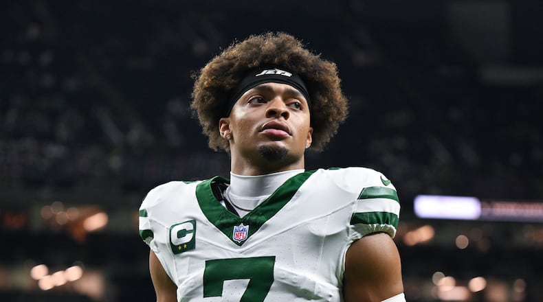 FILE - New York Jets quarterback Justin Fields warms up before an NFL football game against the New Orleans Saints on Dec. 21, 2025, in New Orleans. (AP Photo/Ella Hall, File)