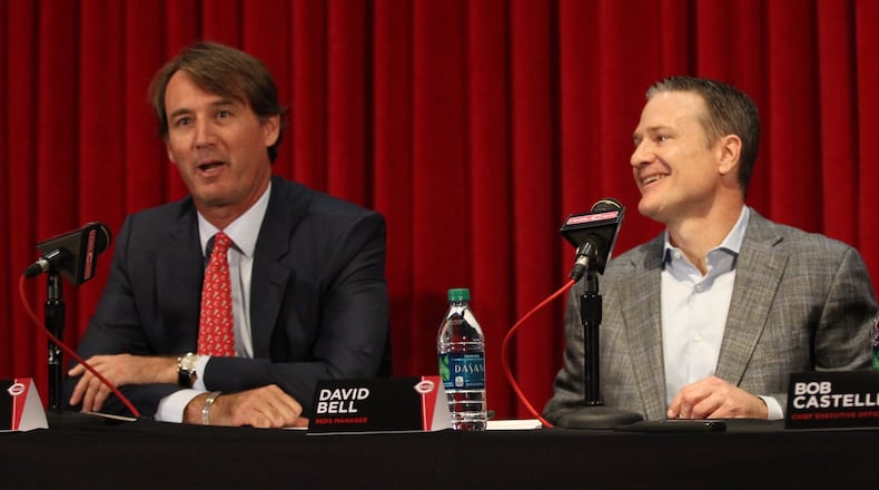 Dick Williams, left, speaks as the Reds introduce David Bell as manager in a press conference at Great American Ball Park on Monday, Oct. 22, 2018, in Cincinnati. David Jablonski/Staff