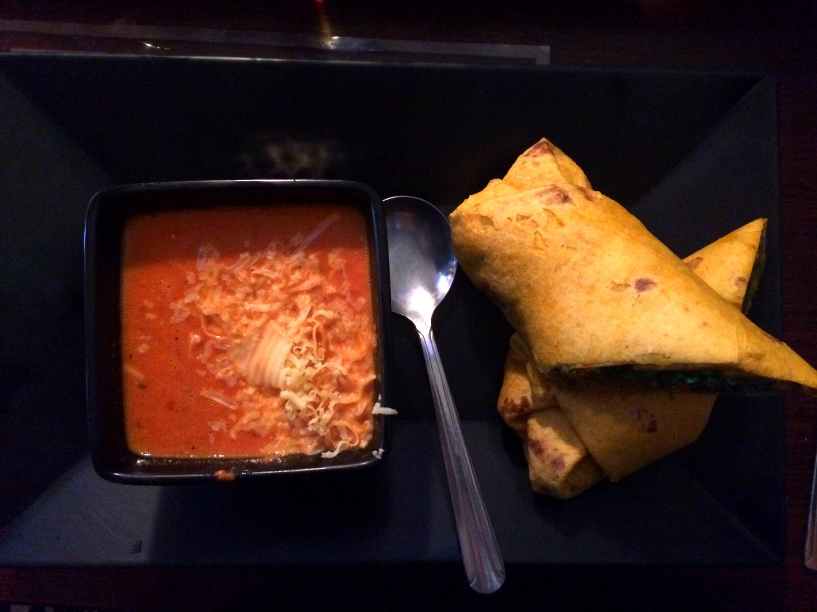 The Veggie-tarian at Fifth Street Brewpub. Housemade black bean hummus, corn and pepper relish, cheddar cheese, lettuce, tomato, and a cilantro-lime dressing served in a cheddar-jalapeno tortilla. Served here with Fifth Street's Roasted Red Pepper and Smoked Gouda soup. VIVIENNE MACHI / STAFF