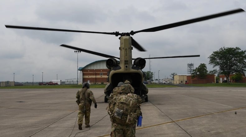 Airmen assigned to the 178th Wing board an Ohio National Guard CH-47 Chinook helicopter assigned to Company B, 3rd Battalion, 238th Aviation Regiment during a combat readiness inspection at Springfield-Beckley Air National Guard Base, July 14, 2025. Guard photo.