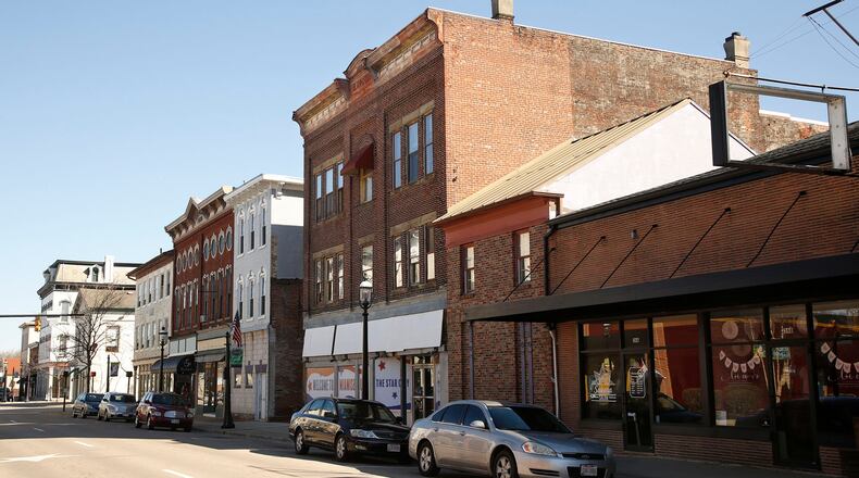 A $2.2 million plan to restore the former Suttman’s Men’s and Boys’ Wear building, center, now has financing in place. STAFF