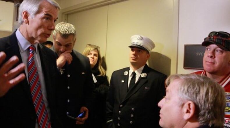 Sen. Rob Portman talks to 9/11 first responders and former Daily Show host Jon Stewart. PHOTO FROM HUFFINGTON POST