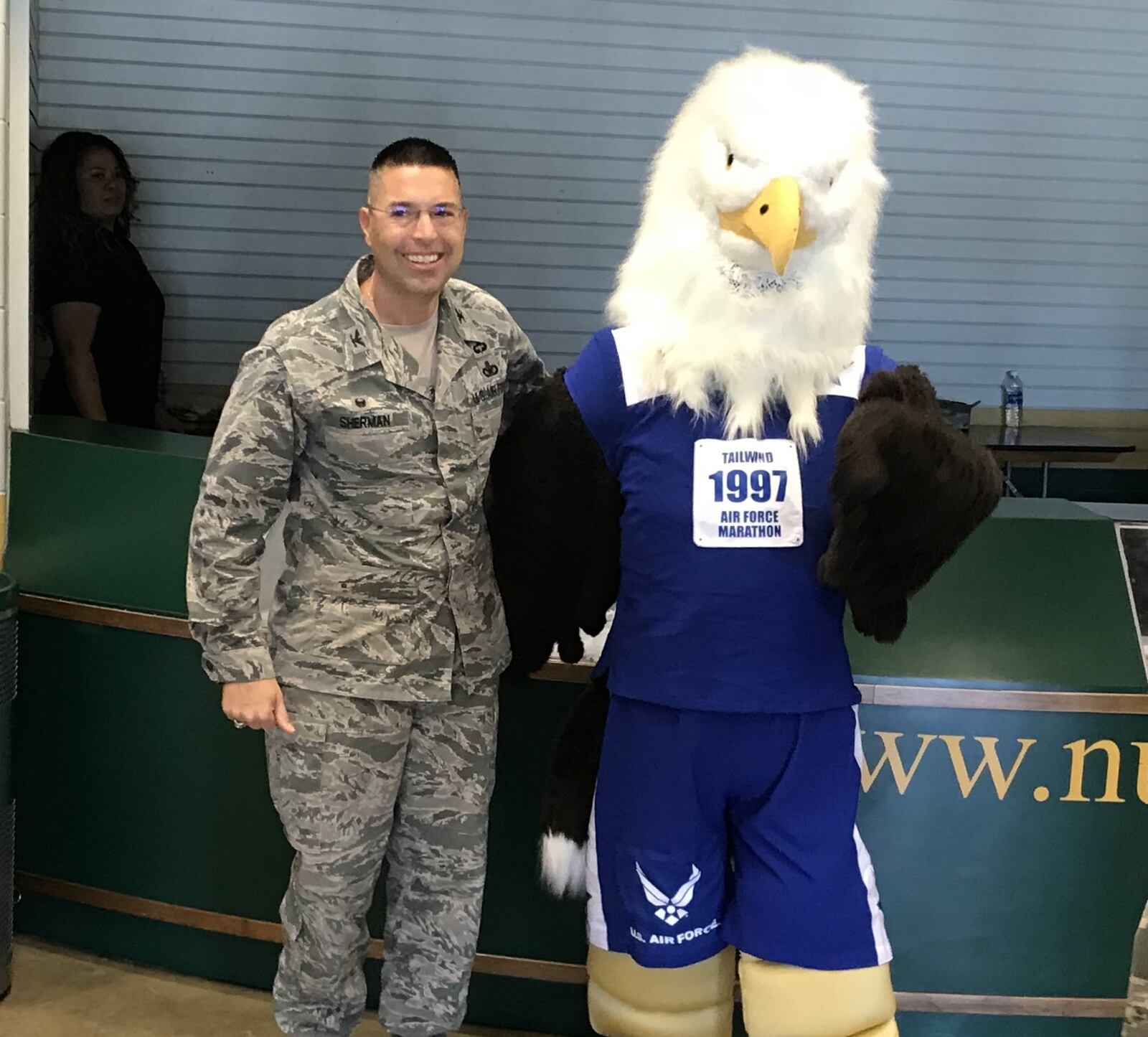 Col. Tom Sherman, installation commander of the 88th Air Base Wing at Wright-Patterson Air Force Base poses for a photo at the expo before the Air Force Marathon.