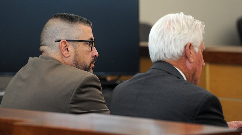 Former Butler Twp. Police sergeant, Todd Stanley, left, sits with his attorney at his sentencing hearing in Vandaila Municipal Court, Friday, Sept. 29, 2023.  MARSHALL GORBY\STAFF