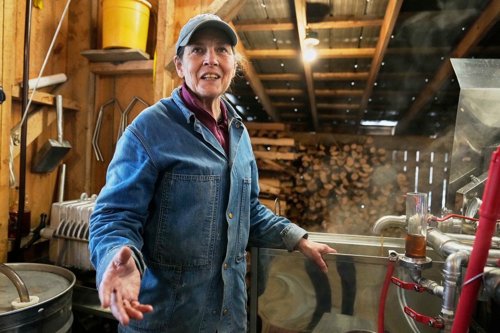 Maple syrup producer Donna Young talks of the uncertainties facing her business caused by the Trump administration's tariffs with Canada in Morgan, Vt., on Friday, April 11, 2025. (AP Photo/Robert F. Bukaty)