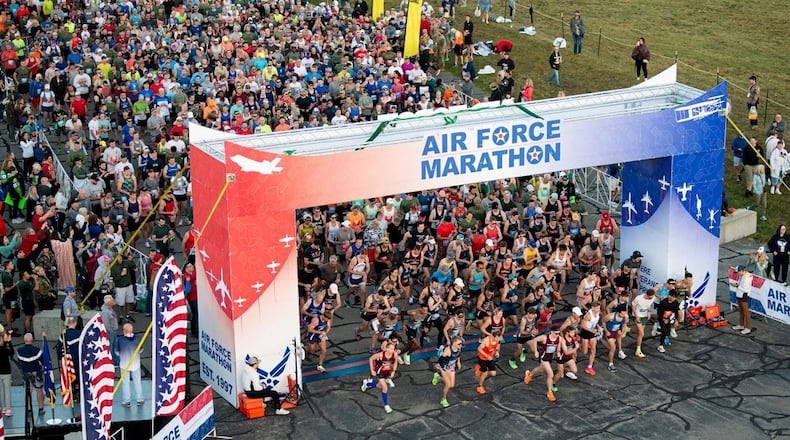 Full and half marathon runners pour through the starting line of the 27th annual Air Force Marathon on Sept. 16, 2023, near the National Museum of the U.S. Air Force, Wright-Patterson Air Force Base. More than 8,500 runners and 1,500 volunteers from all 50 states and 18 countries participated in the event. (U.S. Air Force photo by Jaima Fogg)