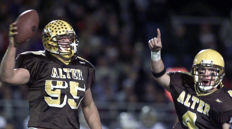 Nick Mangold (55) celebrates recovering a first quarter fumble with teammate John Sweeney. Alter played St. Francis Desles in a division III semifinal football game.