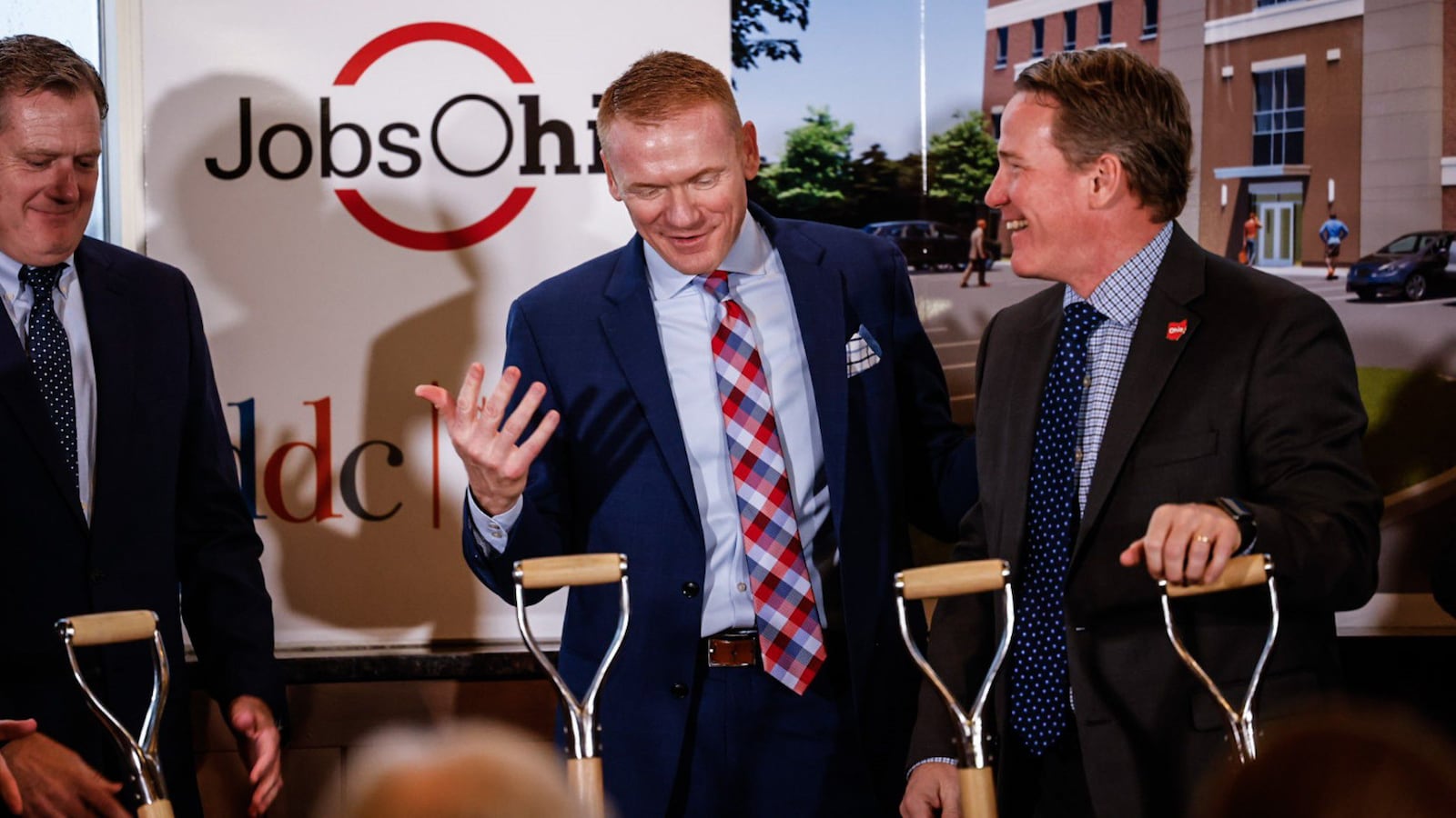 From left, Ohio Congressman, Mike Turner, President & CEO of Synergy Building Systems, Jerad Barnett and Ohio Lt. Governor, Jon Husted celebrates the groundbreaking of a new office development for defense contractors Friday March 3, 2023. The new $19 million office building will be off Colonel Glenn Highway in Beavercreek.  JIM NOELKER/STAFF