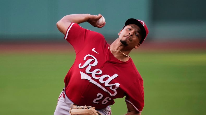 Cincinnati Reds pitcher Chase Burns delivers during the first inning of a baseball game against the Boston Red Sox at Fenway Park, Monday, June 30, 2025, in Boston. (AP Photo/Charles Krupa)
