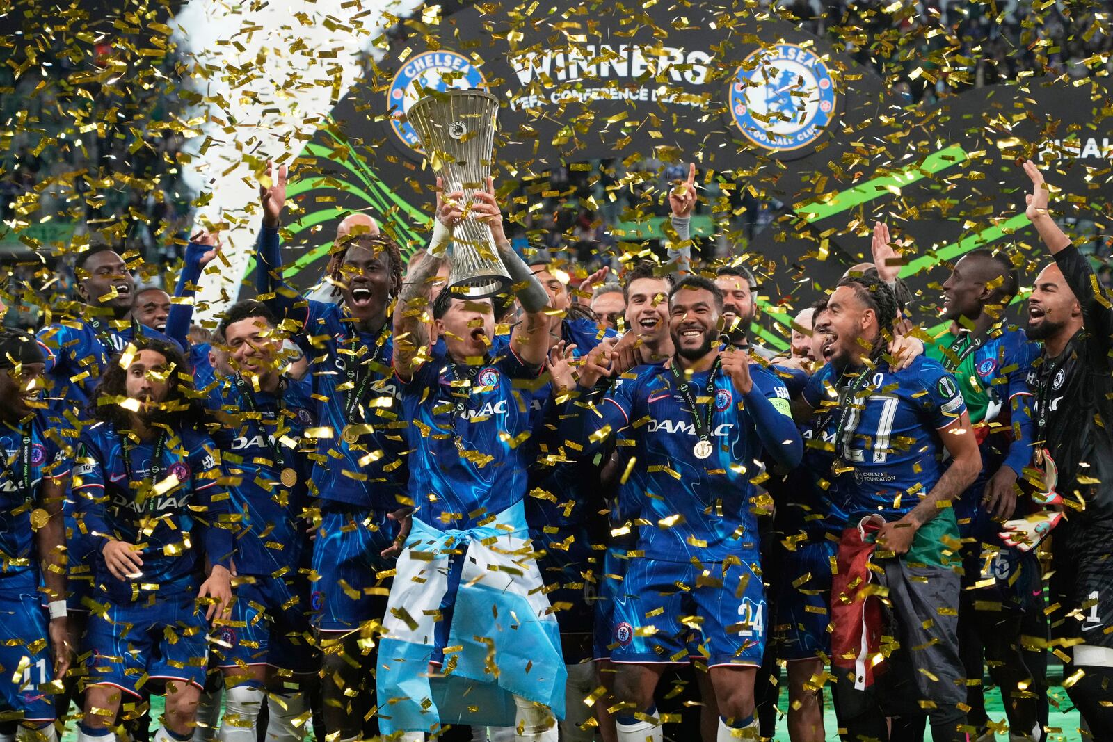 Chelsea's Enzo Fernandez lifts the trophy after the Europa Conference League final soccer match between Real Betis and Chelsea in Wroclaw, Poland, Wednesday, May 28, 2025. (AP Photo/Czarek Sokolowski)