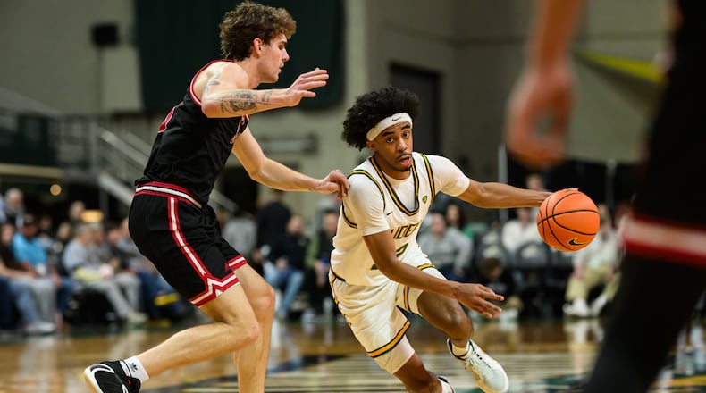 Wright State University sophomore TJ Burch drives past IU Indy freshman Maguire Mitchell during the first half of their game against IU Indy on Thursday, Feb. 19, 2026 at the Nutter Center. The Raiders won 85-73. JEREMY MILLER / CONTRIBUTED PHOTO
