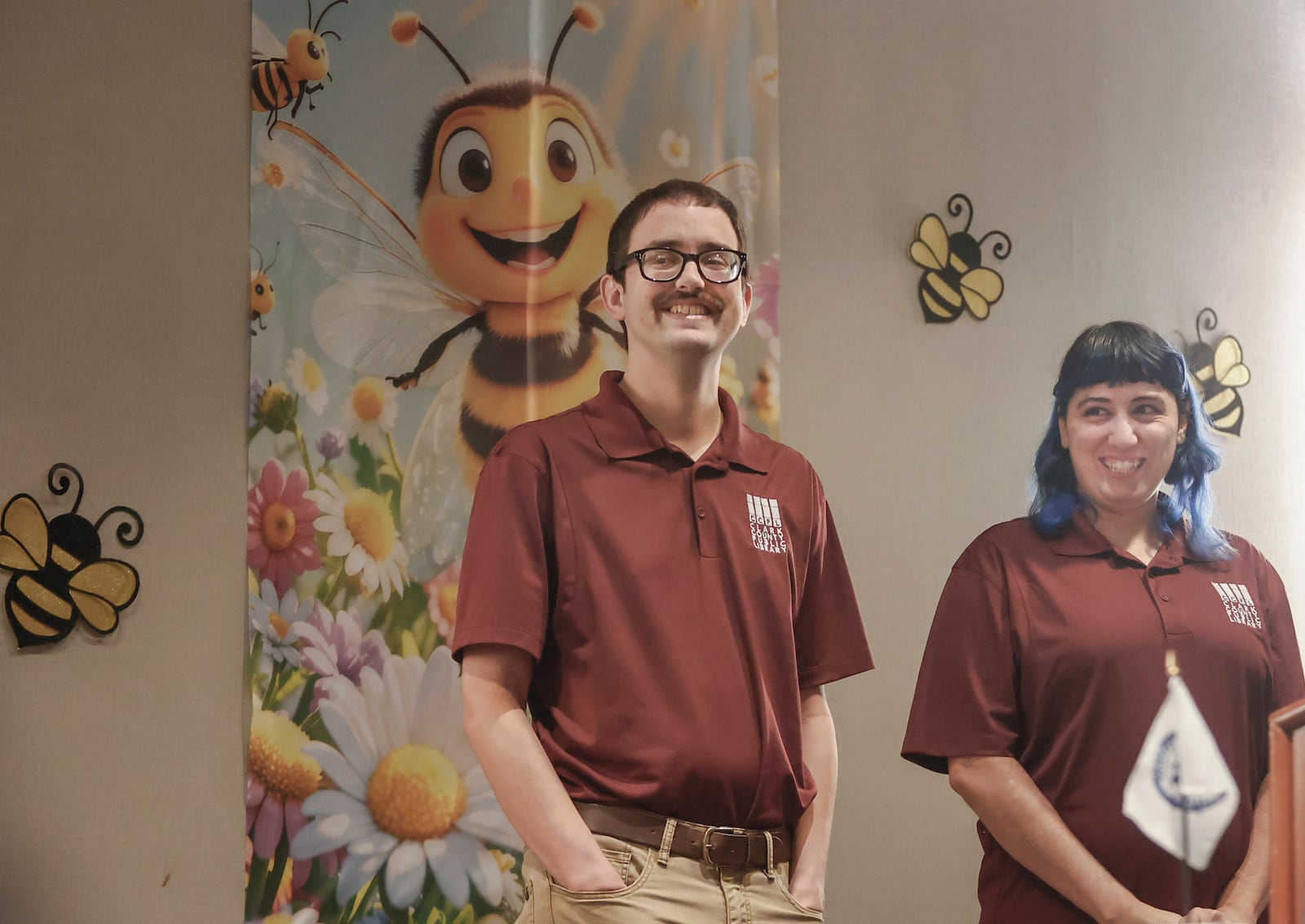 Taylor Smith, left, and Miri Reyes, of "Bee A Leader," laugh at a joke before preparing to spell a word during Altrusa's 26th annual Literacy Sting on Tuesday, September 23, 2025, at Springfield Courtyard by Marriott. Their team finished in first place. JOSEPH COOKE/STAFF