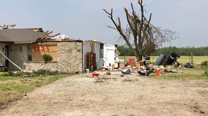 Tornado damage to a home east of Laura on State Route 571 in Miami County. STEVE BAKER / STAFF