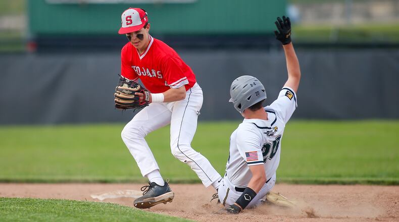 Southeastern High School sophomore shortstop Gehrig Cordial attempts to throw the ball to first base after making contact with Troy Christian's Camden Koukol during a Division IV district semifinal game on Monday, May 23, 2022, at Troy High School's Market Street Field. The Trojans won 3-0. Contributed photo by Michael Cooper