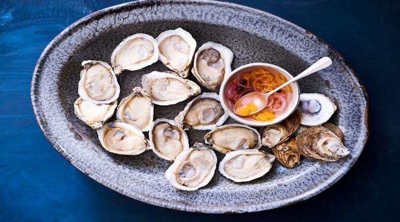UNDATED â BC-EVERYDAY-FOOD-OYSTERS-ART-NYTSF â Plump, juicy raw oysters are topped with a drizzle of tangy vinegar sauce. (CREDIT: MIKKEL VANG)--ONLY FOR USE WITH ARTICLE SLUGGED â BC-EVERYDAY-FOOD-OYSTERS-ART-NYTSF â OTHER USE PROHIBITED.