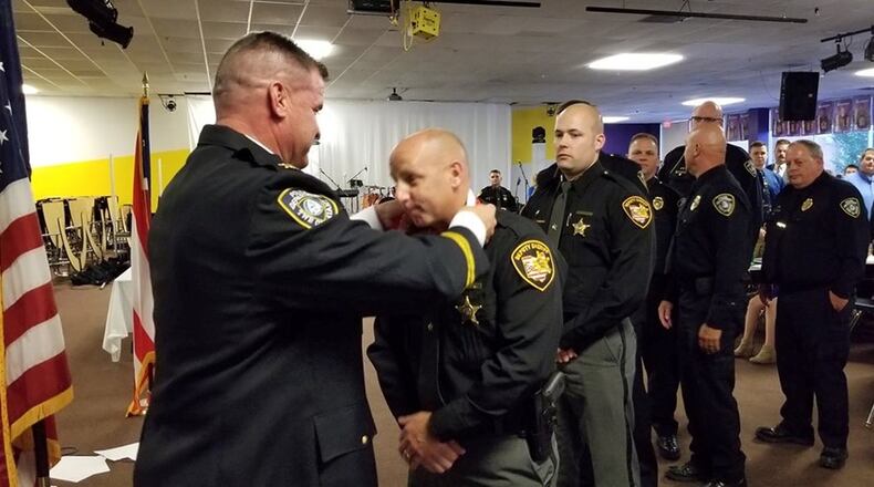 Miami Twp. Police Chief Charlie Stiegelmeyer recognized several officers and staff during an awards banquet Saturday night. CONTRIBUTED
